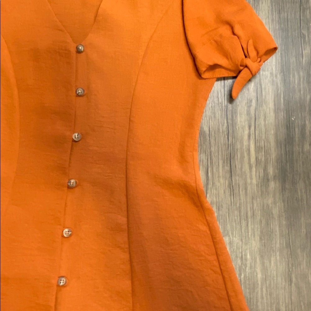 Plunging neckline mini dress with details on sleeves